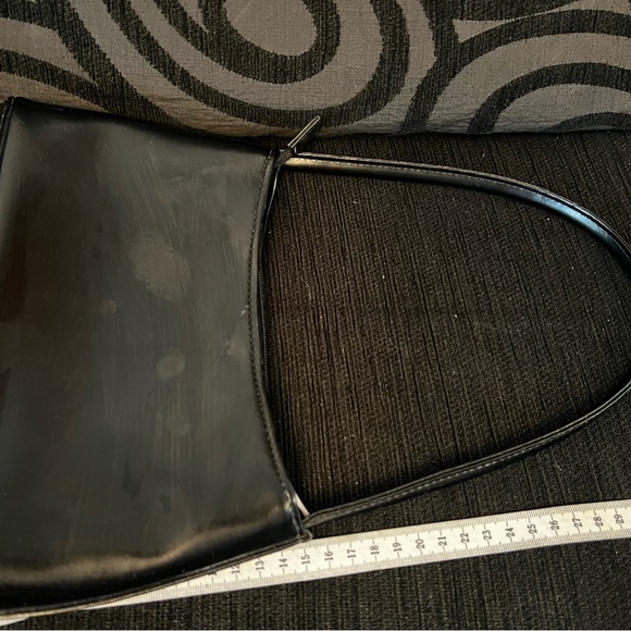 Black handbag. Silver coloured details on zip, feet on bottom and side detail - Picture 8 of 8